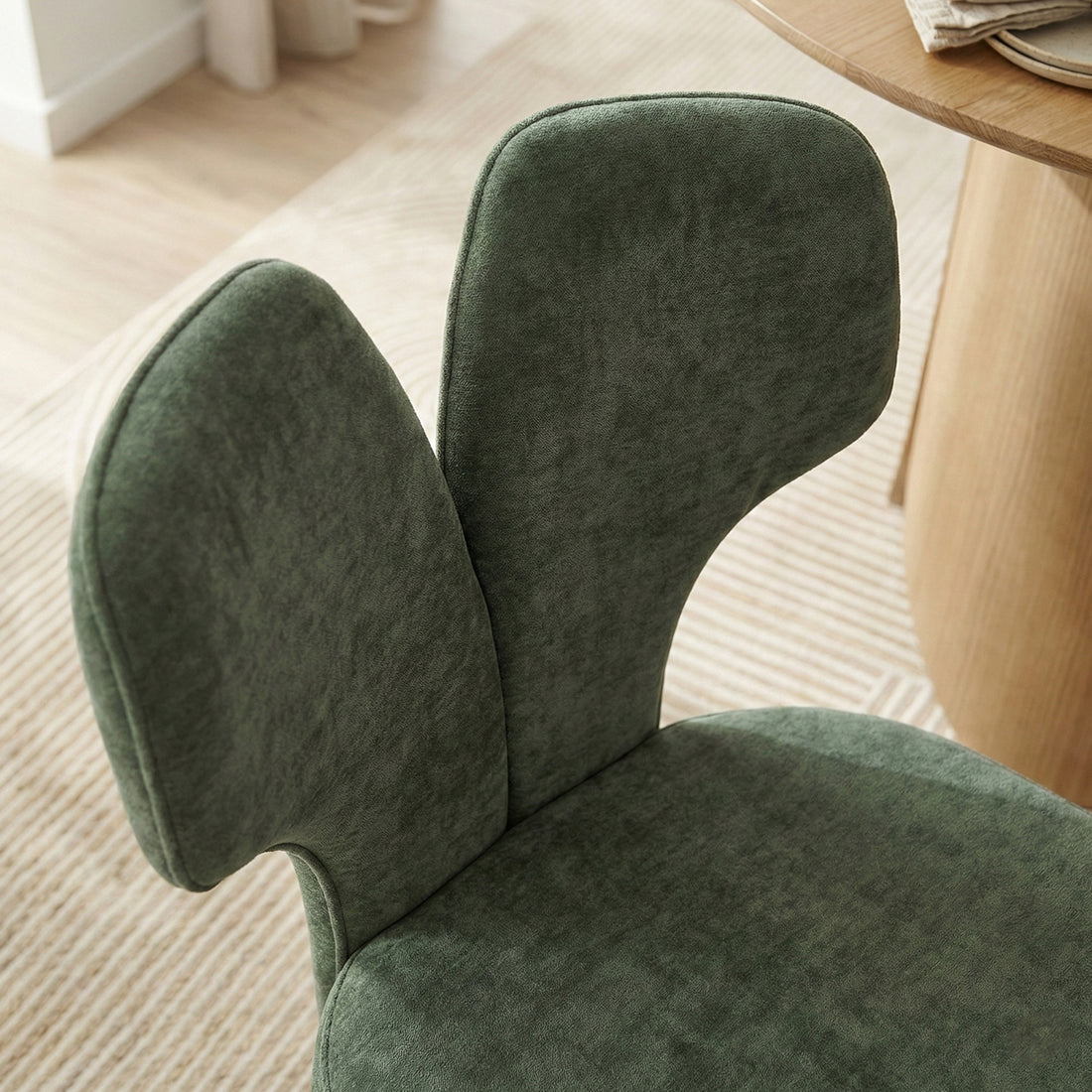 Close-up of chair backrest in a styled room setting