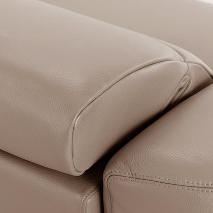 Close-up of beige leather upholstered headrest or armrest detail