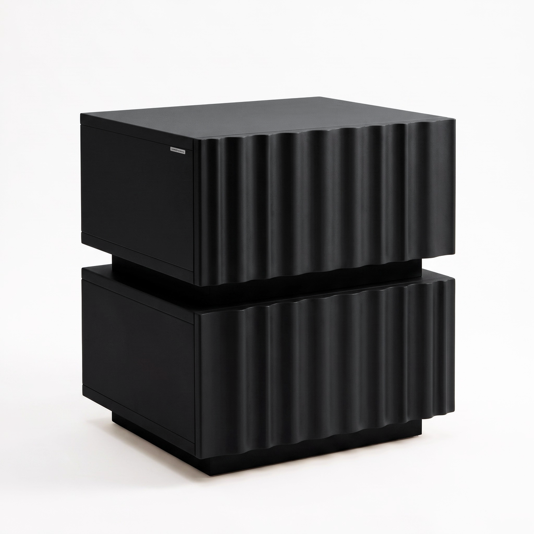 Black modern side table with a wavy textured front on a white background.