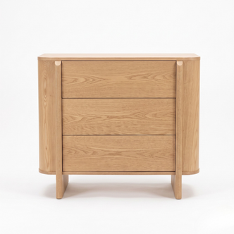 Wooden three-drawer dresser on a white background