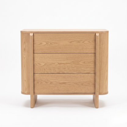 Wooden three-drawer dresser on a white background
