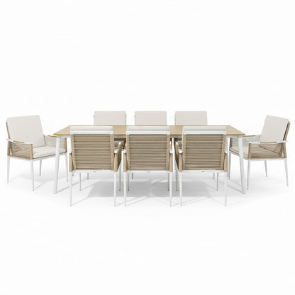 Casara 9 Piece Outdoor Dining Set in White and Beige features a light-wood table with white metal legs, six side chairs, and two armchairs with beige rope-woven backs and cushioned seats.