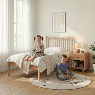 Wooden twin bed in a cheerful children’s bedroom with kids playing on a polka-dot rug