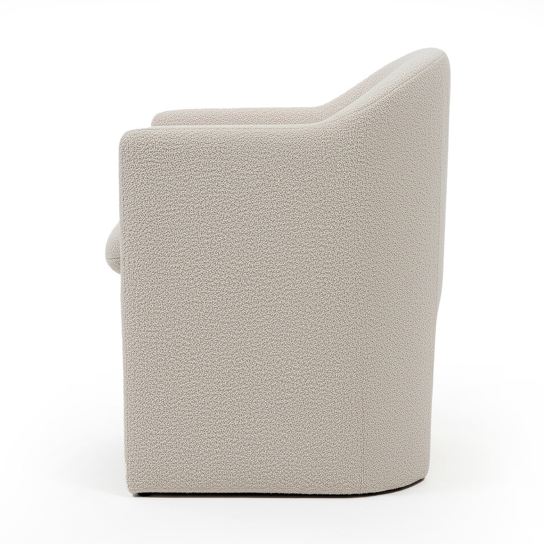 Liora Bouclé Curved Accent Armchair in Beige, featuring a rounded back and armrests, upholstered in textured bouclé fabric with a solid, blocky base, shown against a white background.