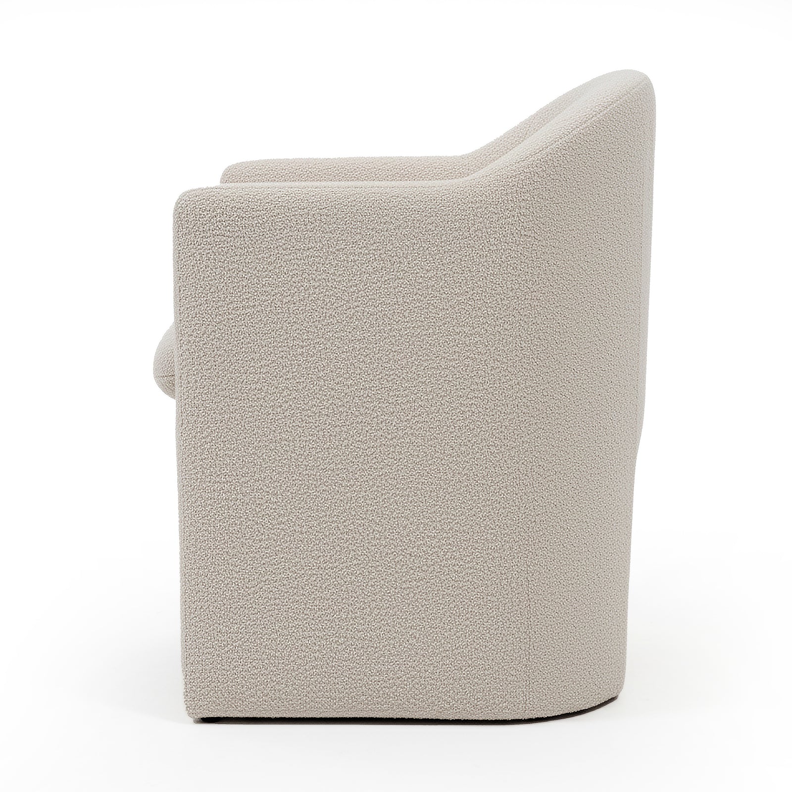 Liora Bouclé Curved Accent Armchair in Beige, featuring a rounded back and armrests, upholstered in textured bouclé fabric with a solid, blocky base, shown against a white background.