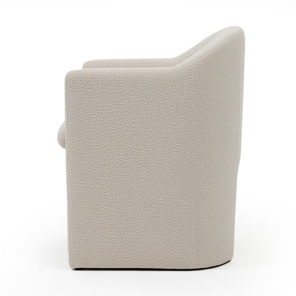 Liora Bouclé Curved Accent Armchair in Beige, featuring a rounded back and armrests, upholstered in textured bouclé fabric with a solid, blocky base, shown against a white background.
