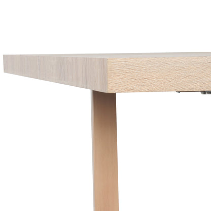 Close-up of the Oregon Dining Table's light-wood tabletop corner and square leg, showcasing its modern, simple design as part of the Oregon Dining Table with 8 Florida Chairs Set in Sand.