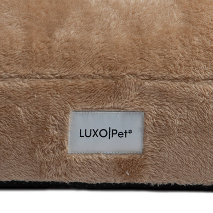 Detailed close-up of plush tan fabric and “LUXOPet” label