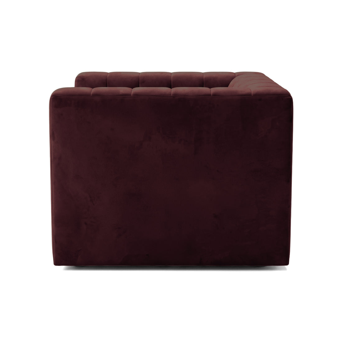 Side view detail of a Dark Merlot upholstered armchair on white background