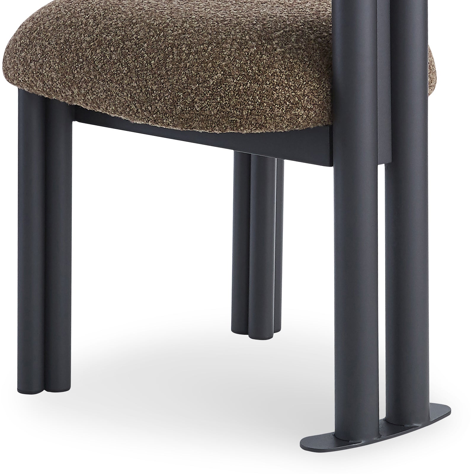 Norii Boucle Fabric Dining Chair in Rust Brown, showcasing its underside padded seat with coarse fabric and tubular matte black metal legs, highlighting its modern, sturdy design.