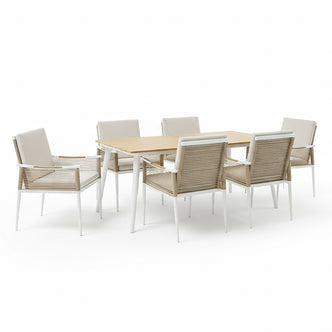 Casara 7 Piece Outdoor Dining Set in White & Beige features a rectangular table with a teak-look top and white metal legs, plus six matching chairs with tan woven rope sides and neutral cushions.