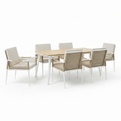 Casara 7 Piece Outdoor Dining Set in White & Beige features a rectangular table with a teak-look top and white metal legs, plus six matching chairs with tan woven rope sides and neutral cushions.