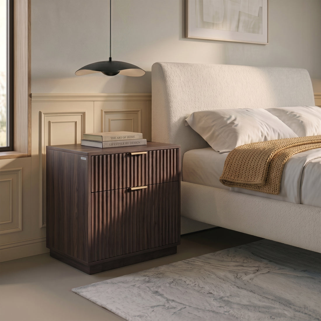 Walnut nightstand beside a bed in a styled bedroom