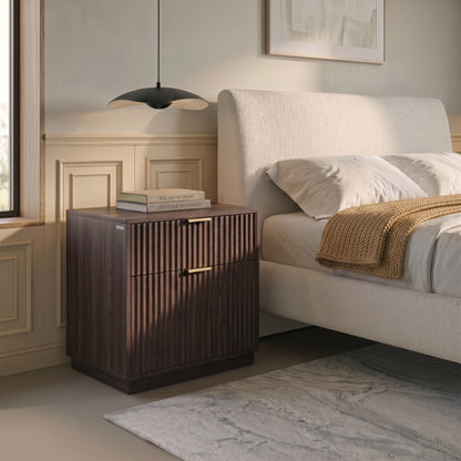 Walnut nightstand beside a bed in a styled bedroom