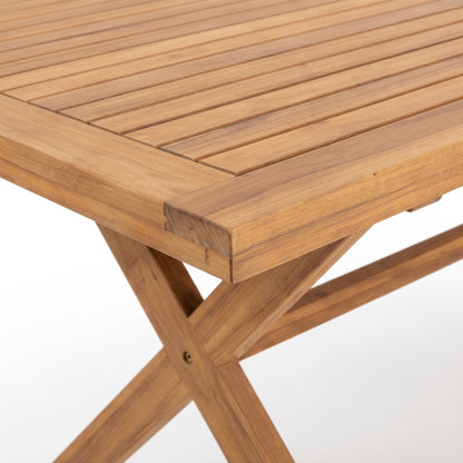 Close-up of a wooden table corner and cross-braced legs