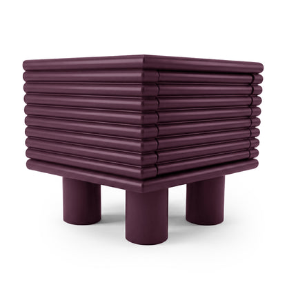 Stacked ribbed plum side table on white background