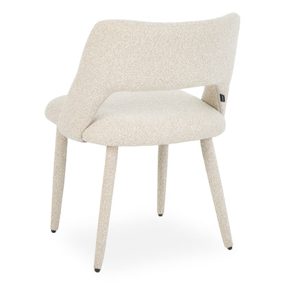 Back view of cream upholstered chair on white background