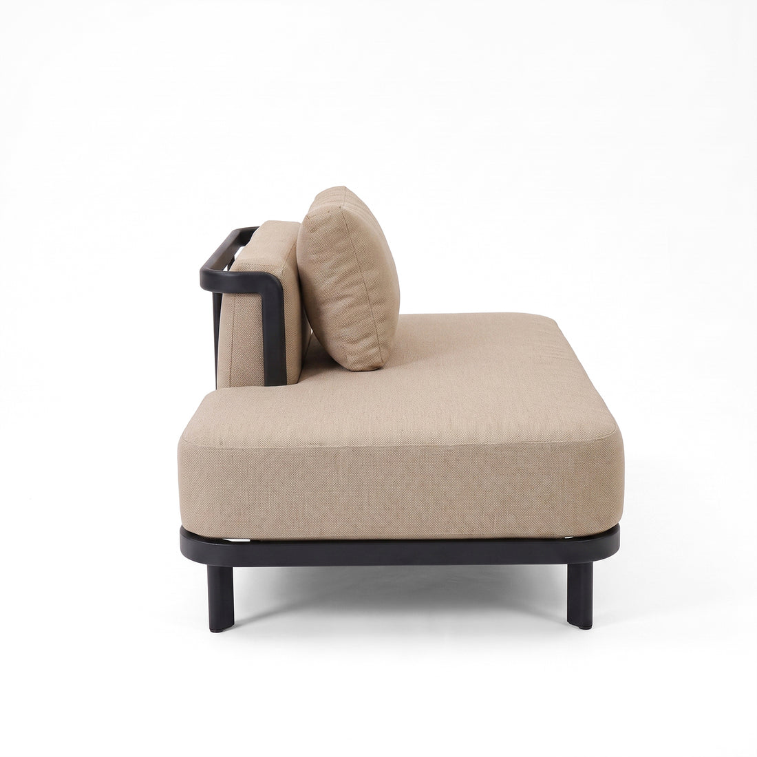 Side view of a beige upholstered sofa on white background.