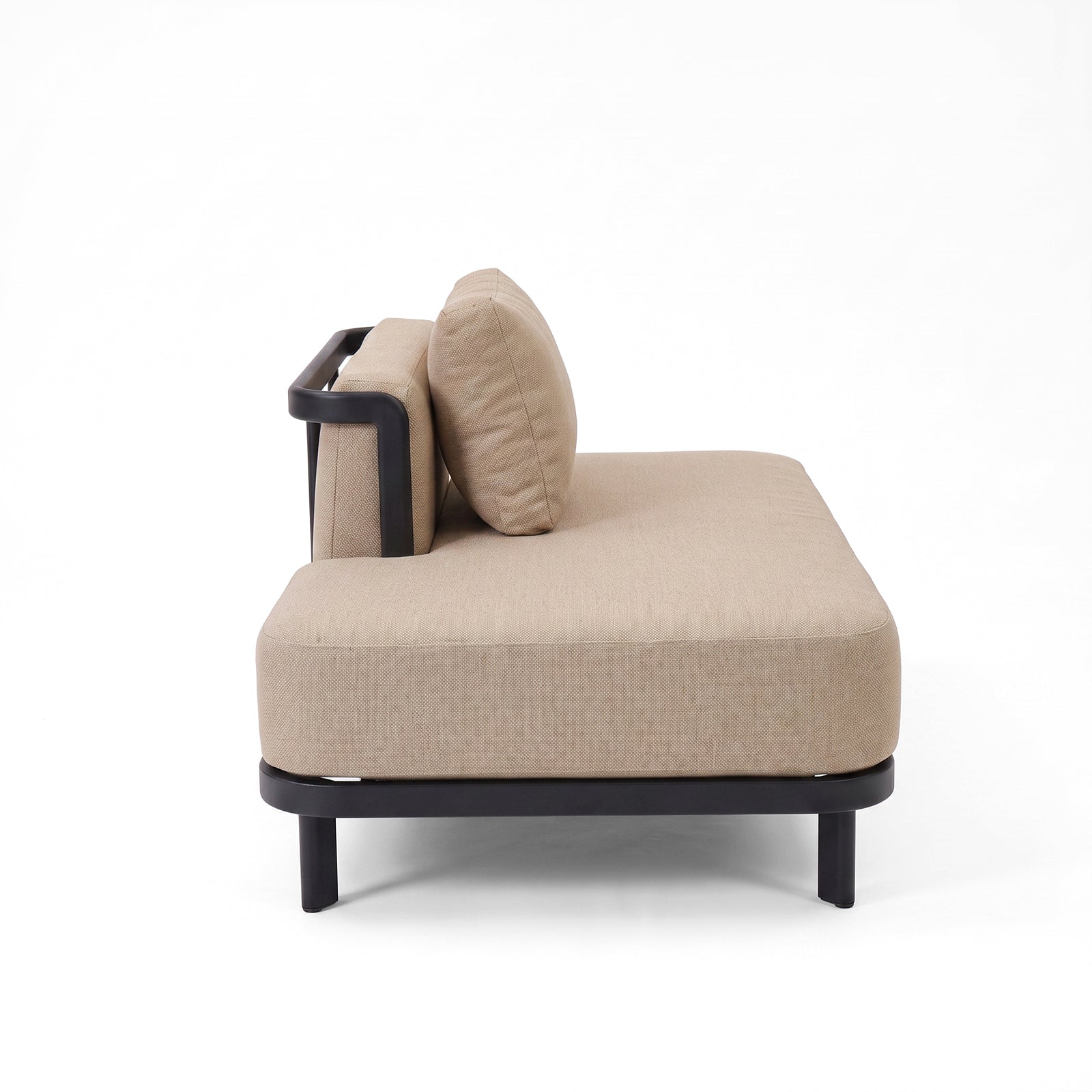 Side view of a beige upholstered sofa on white background.