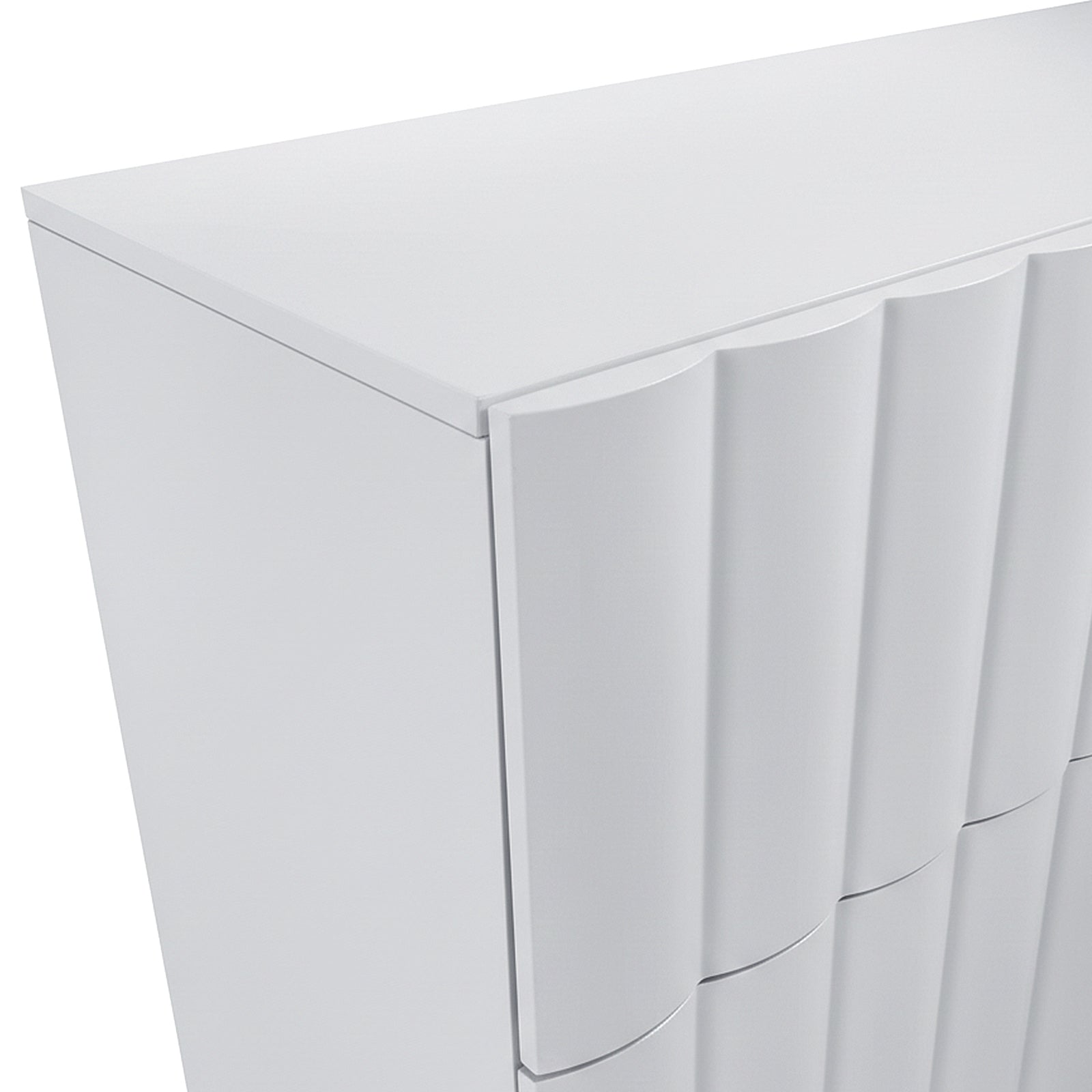 Angled view of top corner of white cabinet showing wavy front panels on white background