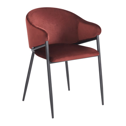 Side-angled view of burgundy velvet chair on white background