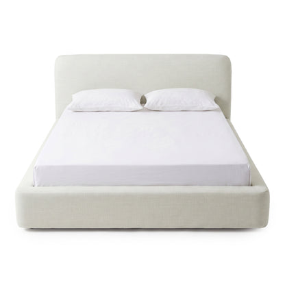 Front view of a modern upholstered bed on a white background