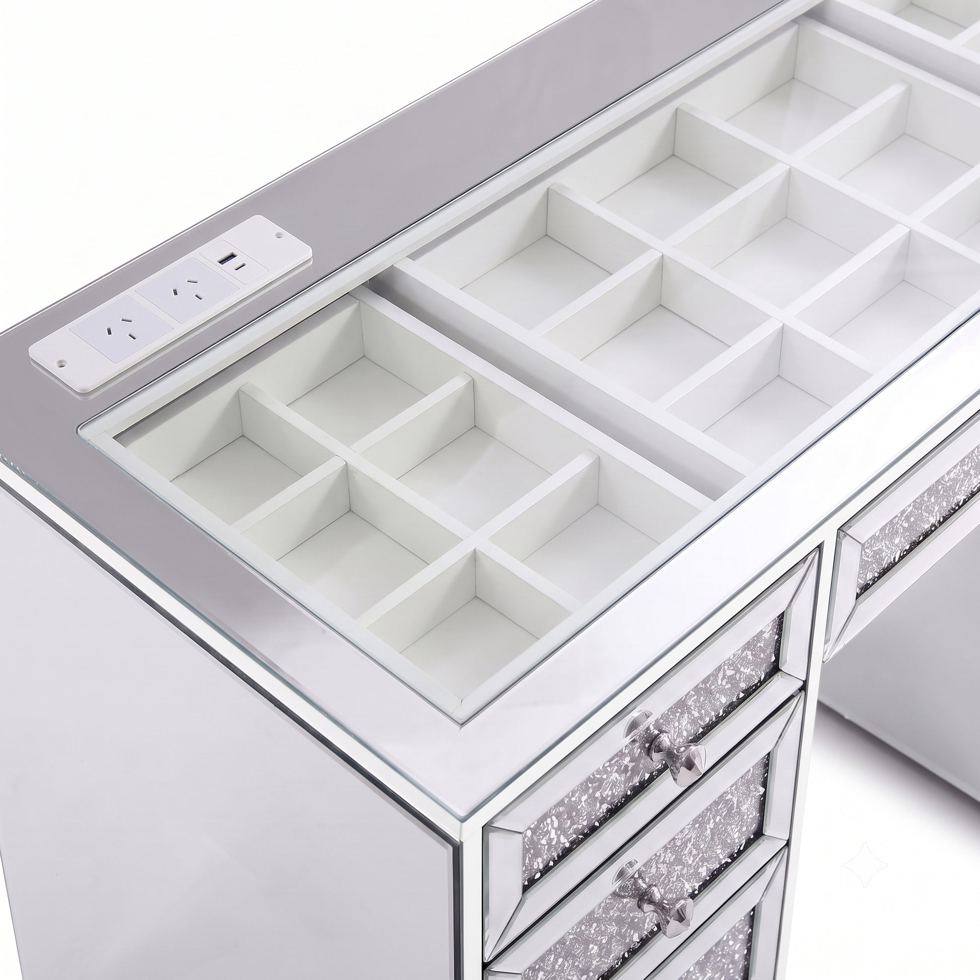 Top section of a mirrored vanity with open organizer compartments and drawers