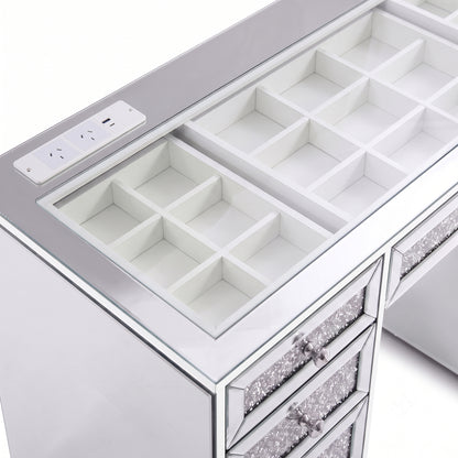 Top section of a mirrored vanity with open organizer compartments and drawers