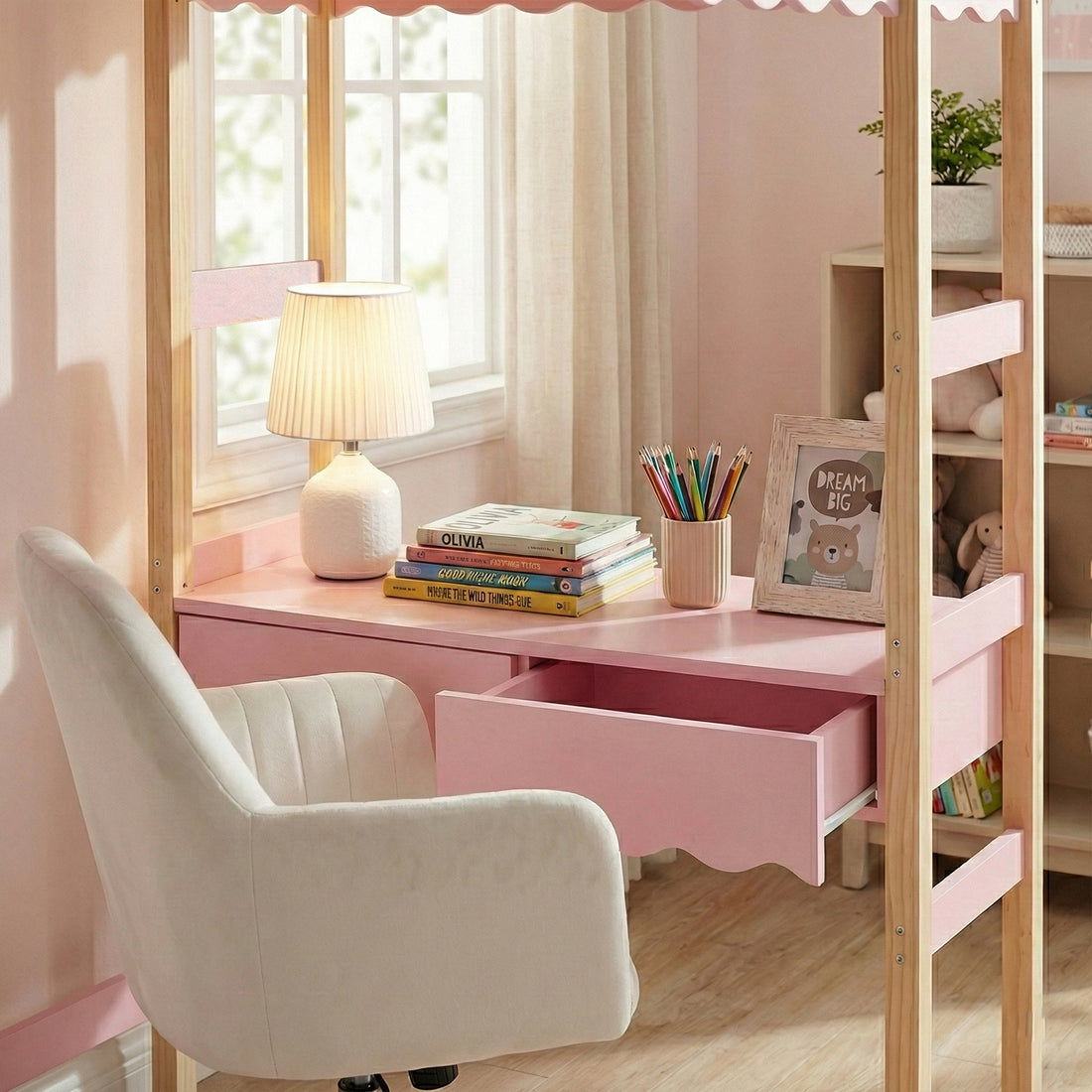 Lofted desk nook with pink drawers and wood elements in a decorated children’s room