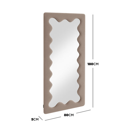 Serena 180cm Full Length Mirror features a taupe padded frame with a wavy mirror design, providing a stylish, full-length view that enhances space and light in your room.