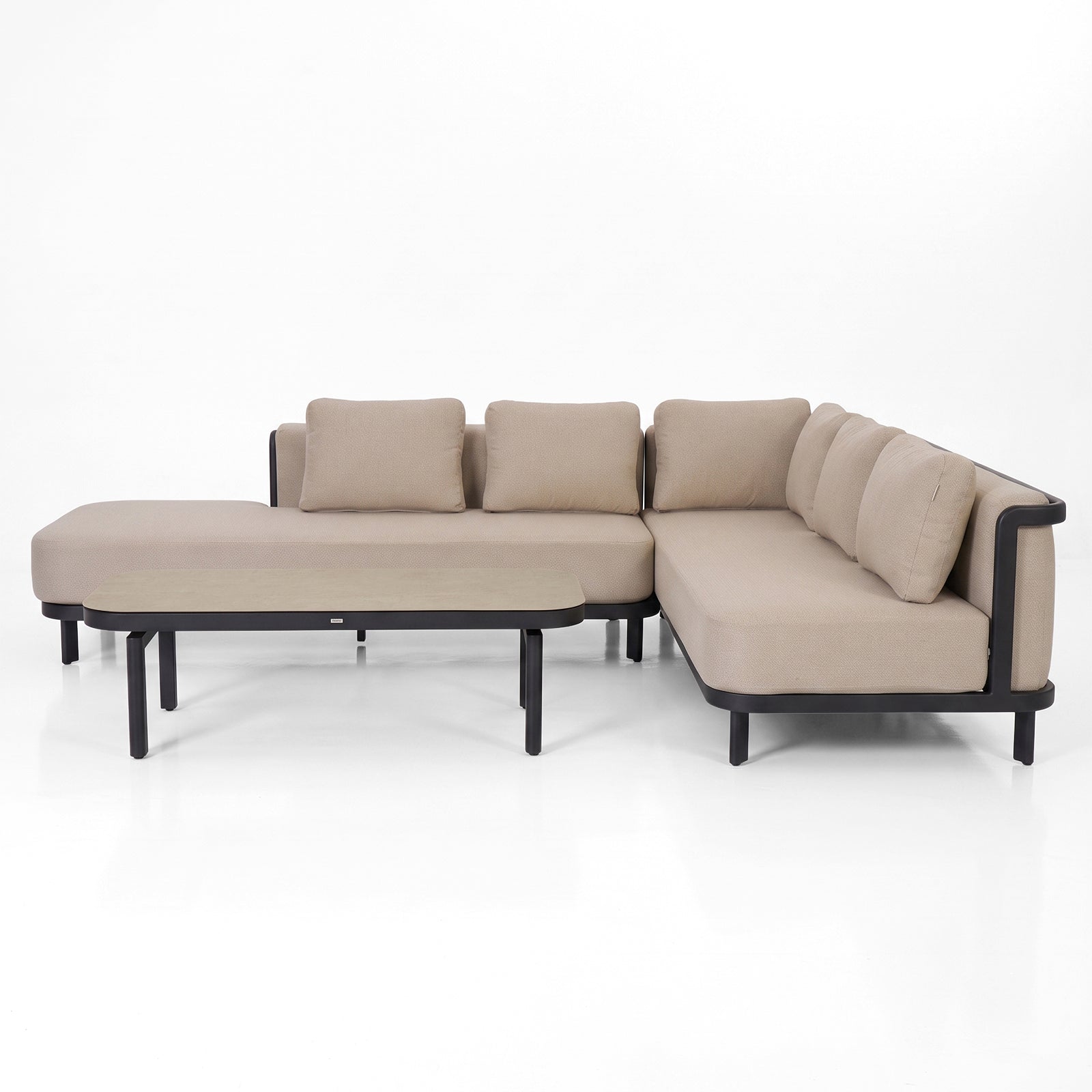 Beige sectional sofa with chaise on white background.