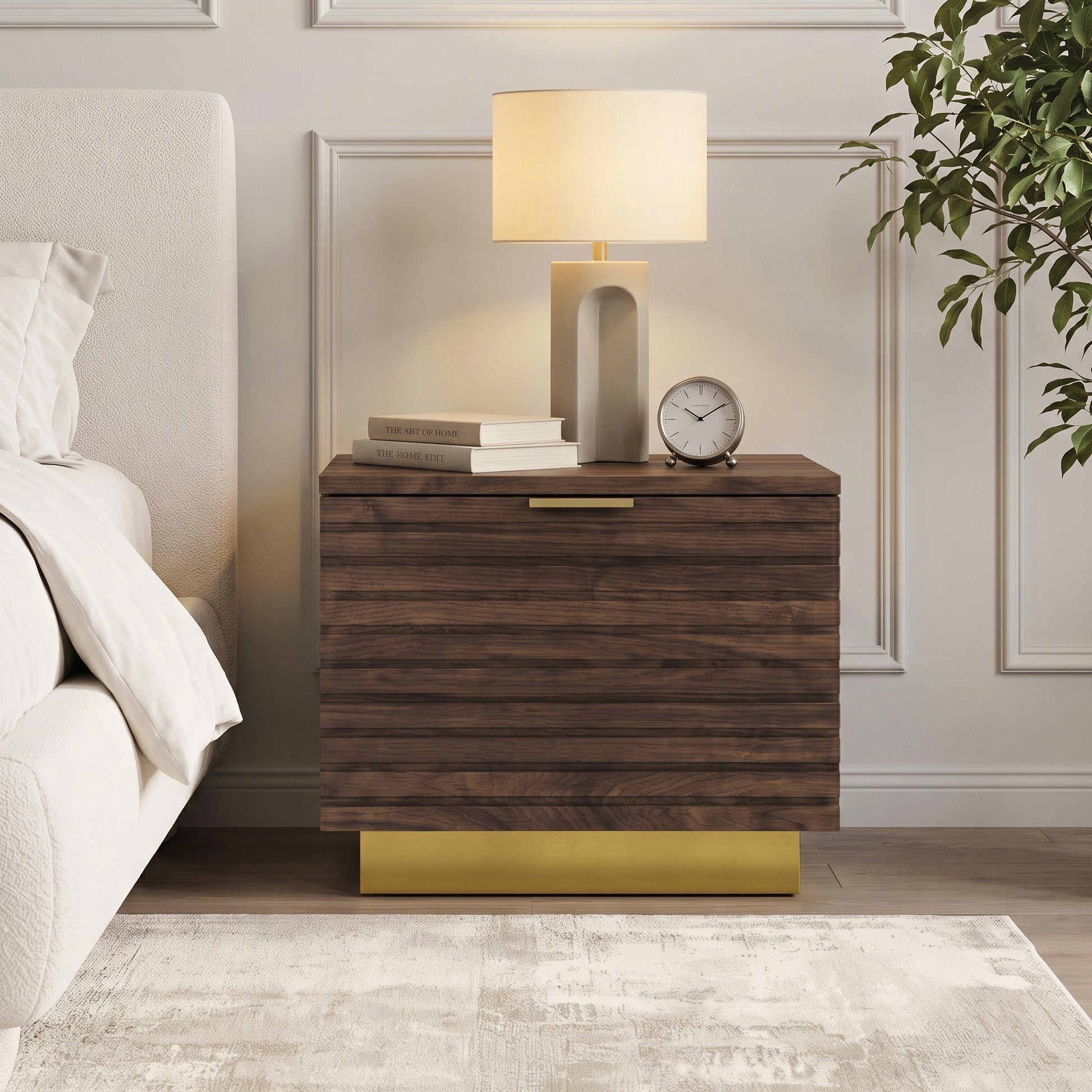 Dark wood nightstand styled beside a bed in a modern bedroom