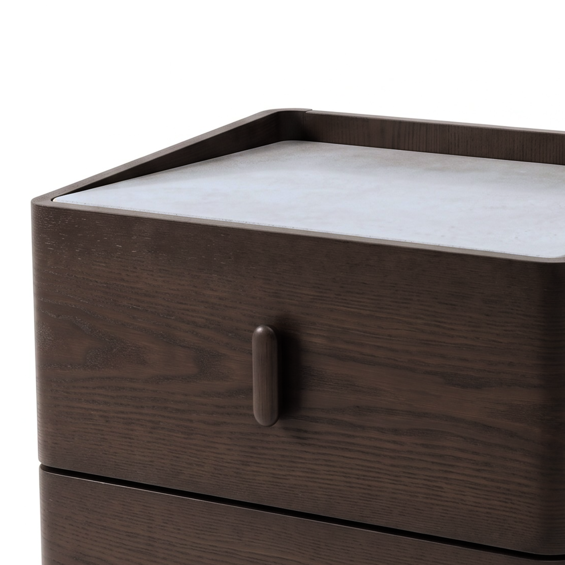 Close-up of the upper section of a dark wood nightstand with a light top surface.