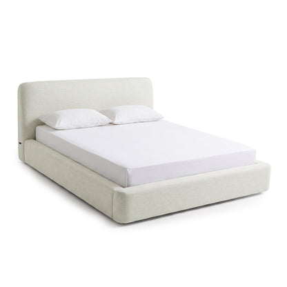 Minimalist upholstered platform bed on a white background