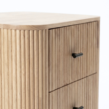 Close-up of the upper corner of a wooden dresser with two drawers
