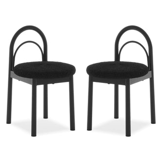 Two modern black chairs with curved backrests and padded seats on a white background
