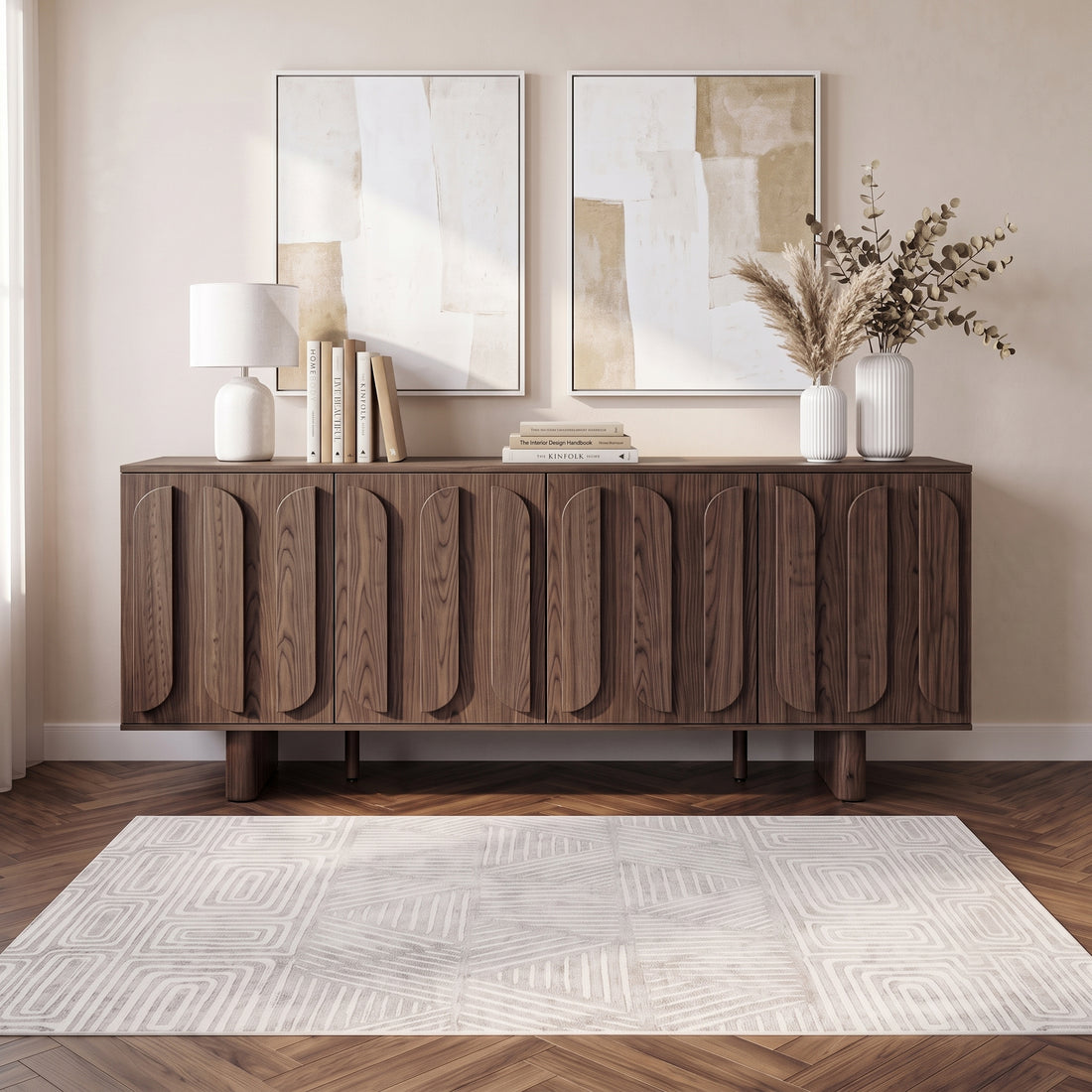 Wooden sideboard styled in a modern room with rug, lamp, artwork, and decor.