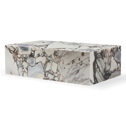 Solene 100cm Coffee Table in Blue Galaxy, showcasing a polished marble slab with unique grey and brown veining, set against a plain white backdrop, highlighting its refined and minimalist design.