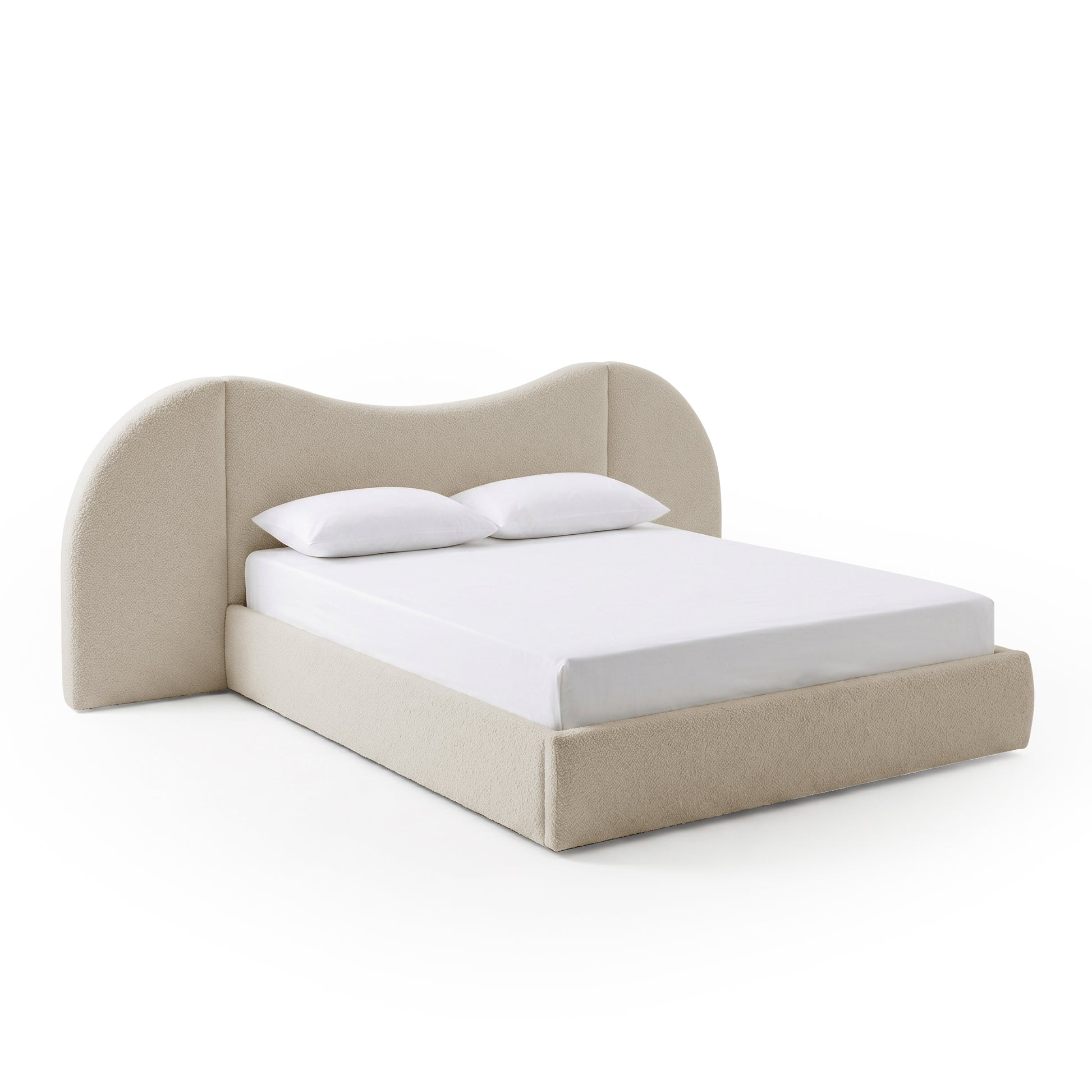 Angled view of upholstered bed with mattress on white background