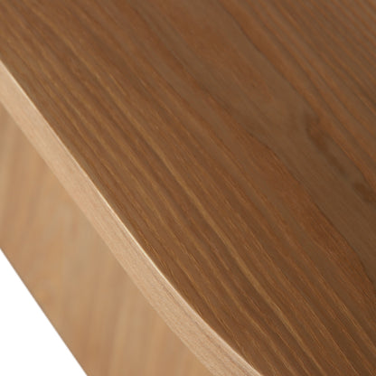 Close-up of the Gigi 180cm Oval Wooden Dining Table in Oak, showcasing its smooth, rounded edge and natural wood grain, highlighting the elegant veneer finish of this stylish, inviting dining centerpiece.
