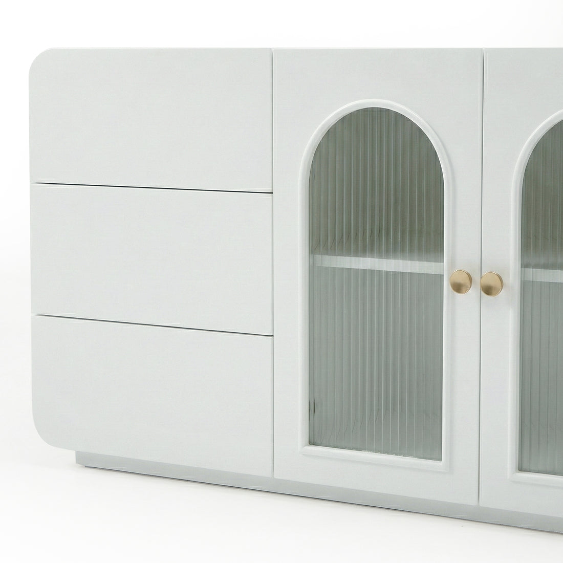 White contemporary sideboard with solid doors and arched glass panels on white background
