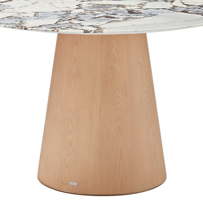 Dina 120cm Round Marble Dining Table features a white marble-look top with brown and gray veining, supported by a tapered, cone-shaped wooden base in a light natural finish.