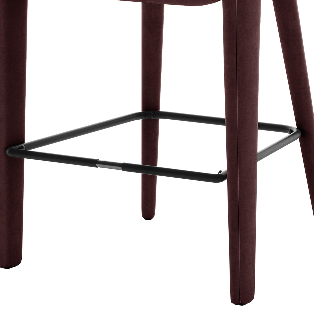 Eisha Velvet Bar Stool Set of 2 in Dark Plum features tapered legs upholstered in dark velvet with a square black metal footrest, exuding a modern, luxurious style for your kitchen or bar area.