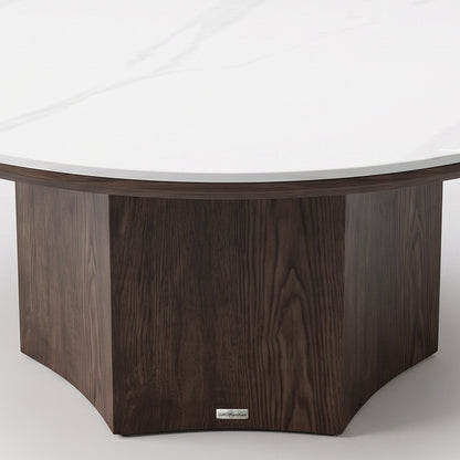 Close-up detail of the lower portion and base of a round table on a white background.