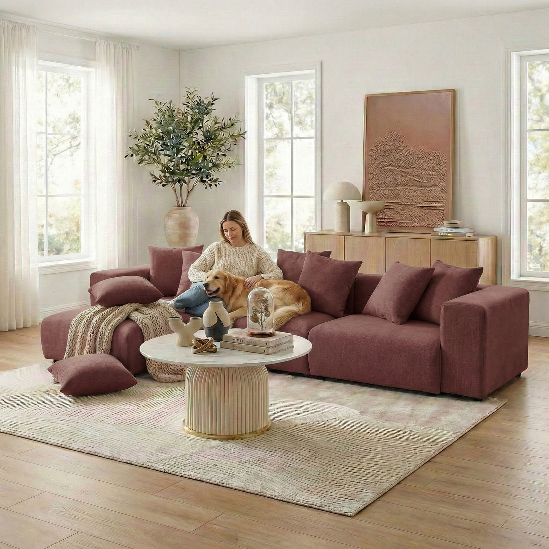 Sectional sofa in a bright living room with person and dog