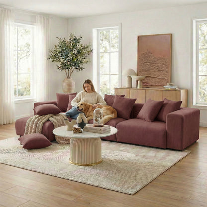 Sectional sofa in a bright living room with person and dog