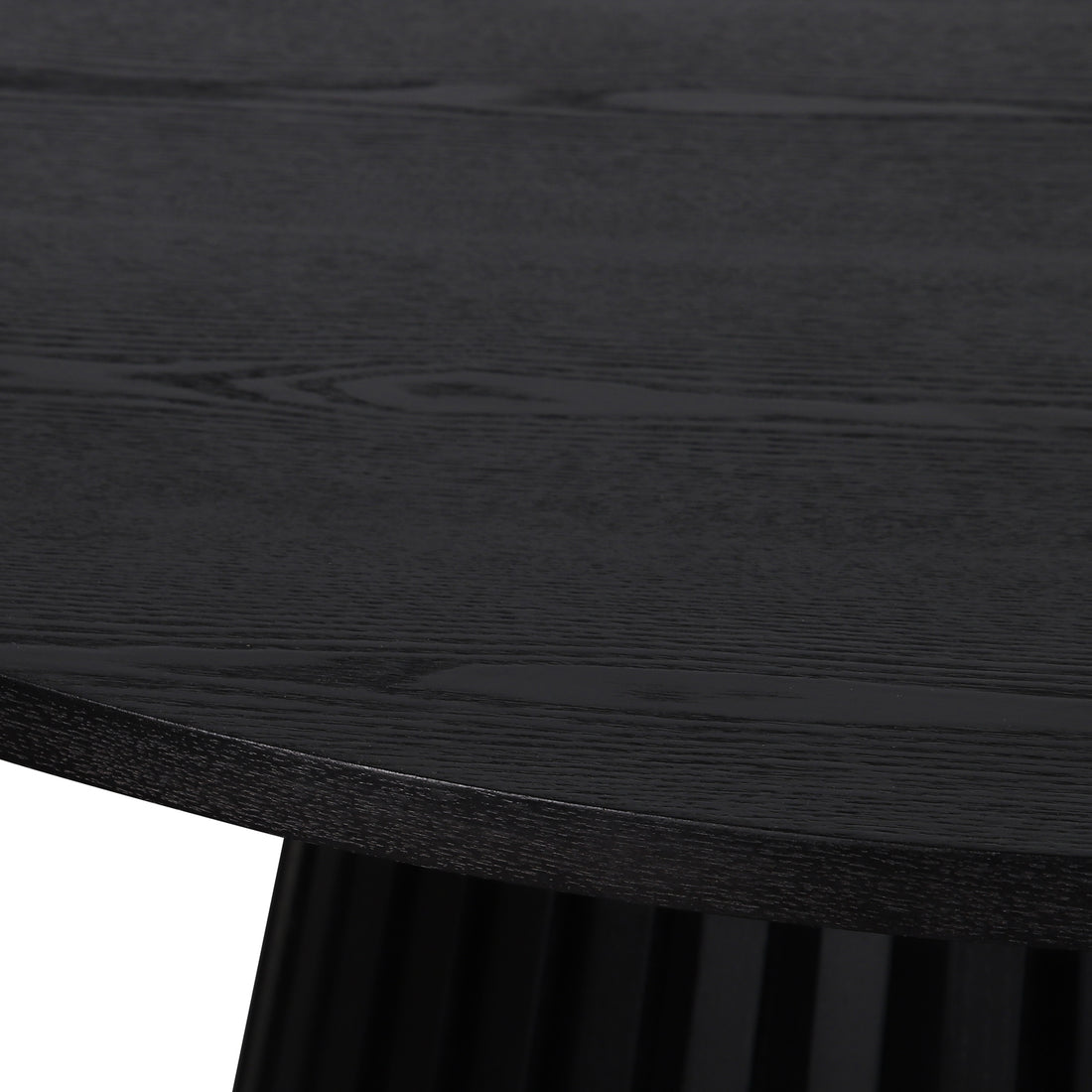 Close-up of the Riri 120cm Round Fluted Wood Dining Table in Black, highlighting its textured wood grain tabletop and the elegantly fluted black pedestal base, showcasing sculptural design and practical elegance.