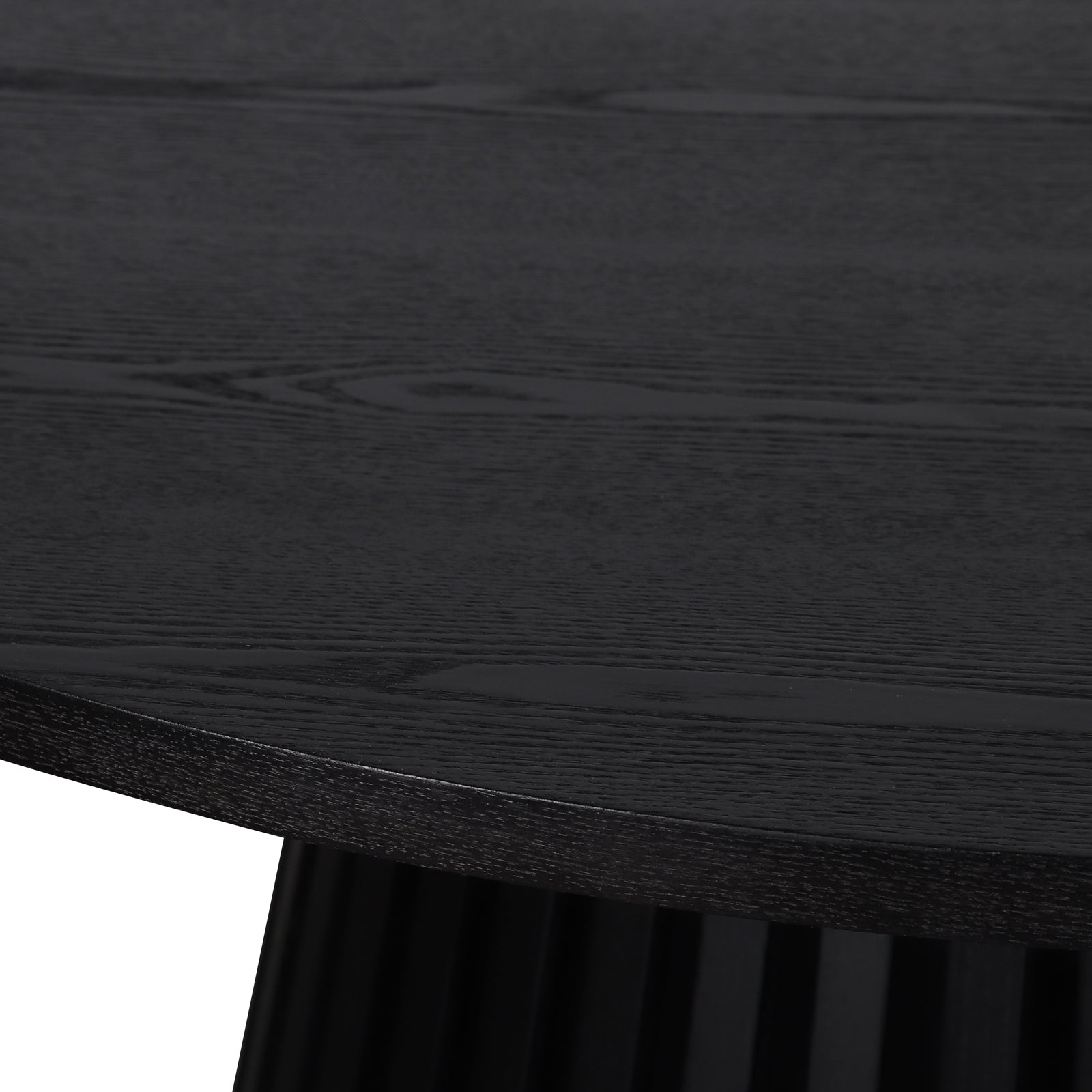 Close-up of the Riri 120cm Round Fluted Wood Dining Table in Black, highlighting its textured wood grain tabletop and the elegantly fluted black pedestal base, showcasing sculptural design and practical elegance.