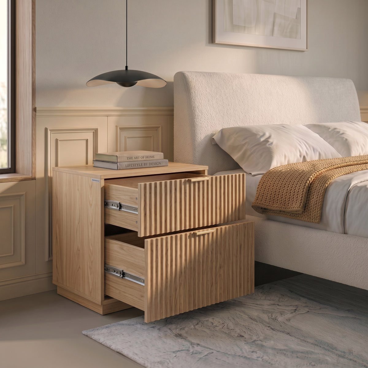Wooden nightstand with open drawers beside a bed in a styled bedroom