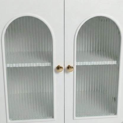 Close-up of white cabinet doors with arched ribbed glass panels